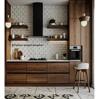 This kitchen combines rustic and industrial elements with warm wood cabinets and a white brick-patterned backsplash. The design includes a breakfast bar with seating and open shelving, creating a stylish yet practical space for any Bangalore home.