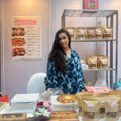 Me at one of my pop-up stalls. I absolutely love meeting my clients in person and sharing my passion for baking with them.