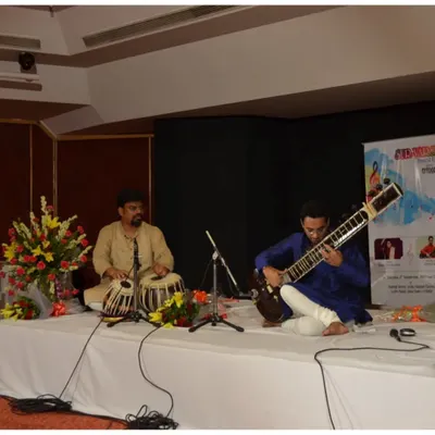 Performing a traditional Hindustani classical recital with a tabla accompanist at the India Habitat Centre, New Delhi. This is the classic setup for a pure musical experience.