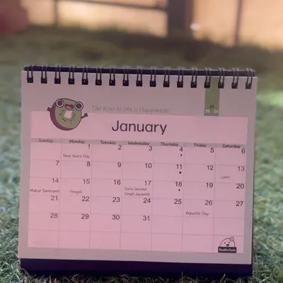 My 2024 desk calendar, which sold out! This one featured a cute kiwi doodle for January with the pun "The Kiwi to life is happiness".