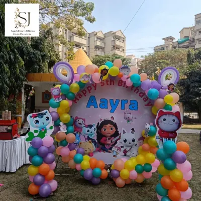 This colorful Gabby's Dollhouse theme was a delight to create for Aayra's 5th birthday. The outdoor setup featured a custom circular backdrop with all her favorite characters, surrounded by a vibrant balloon arch.
