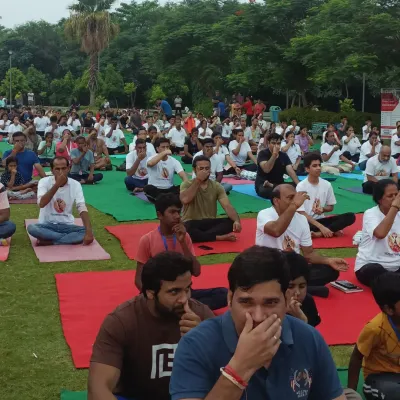This moment captures a large group practicing pranayama, or yogic breathing, together in an outdoor setting. Teaching children and adults to connect with their breath is a fundamental part of my teaching, as it is the bridge between the body and the mind.