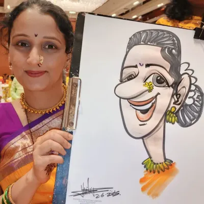 A guest at a traditional wedding function proudly shows off her caricature. My drawings capture the festive spirit and attire, making them a perfect fit for cultural celebrations.