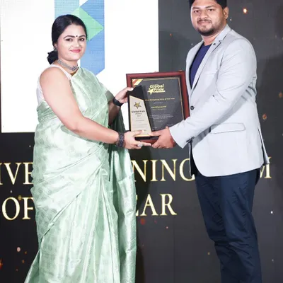We are honored to be recognized for our work. This moment captures us receiving the "Creative Designing Firm of the Year" award, a testament to our team's dedication to pushing the boundaries of design and construction in Bangalore.