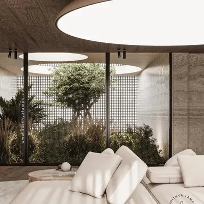 Our stretch fabric ceiling lights create a perfectly uniform, glare-free illumination that can replicate natural daylight. This system is fully customizable in shape and can even feature printed designs, as shown in this hallway with a marble-print effect.