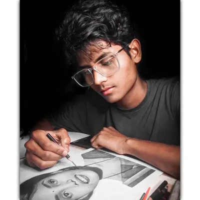 This is me in my workspace, focused on a drawing. Every piece gets my full attention.