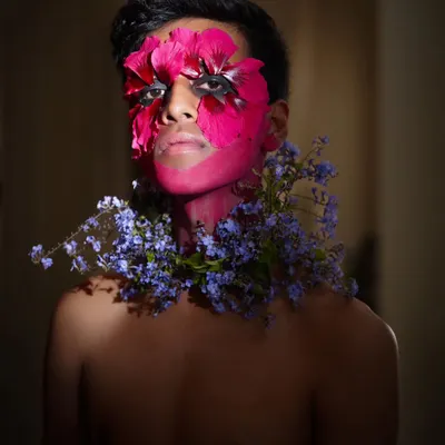 This is from an editorial concept where we explored the fusion of nature and identity. Working with a talented makeup artist, we used fresh flowers and bold color to create a piece of living art, pushing the boundaries of a typical portrait.