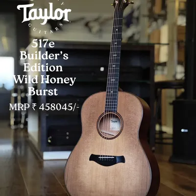 The Taylor 517e Builder's Edition in a Wild Honey Burst finish. This guitar features a torrefied spruce top and mahogany back and sides, offering a warm, vintage tone with modern playability.