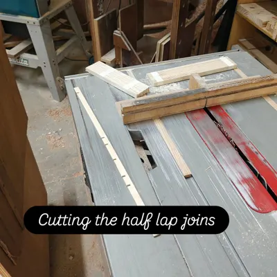 Using a table saw with a specialized jig to cut precise half-lap joints. This joinery technique is fundamental to creating strong, interlocking frames for projects like Kumiko panels.