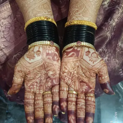 This is the beautiful, dark stain from my homemade organic henna paste, pictured a couple of days after application. The design features traditional motifs perfect for a wedding guest.