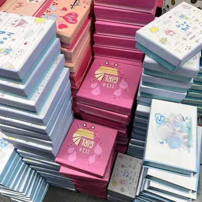 Stacks of my 'It's a Girl' and 'It's a Boy' announcement boxes, ready for a bulk order. These are perfect for sharing your joy with everyone.