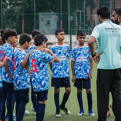 Our U13 team listening intently to their coaches during a Thane Youth League match. Tactical instruction is a key part of our training for senior squads.