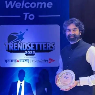 Our founder, Nikhil Tipnis, holding the 'Trendsetters 2022' award. This recognition from Maharashtra Times is a testament to our team's innovative spirit and dedication to culinary excellence.