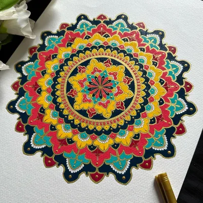 This ornate mandala is a symphony of primary colors: red, yellow, and blue, accented with deep navy and gold. Painted on A3 paper, its vibrant and detailed design is perfect for making a statement in any living space.
