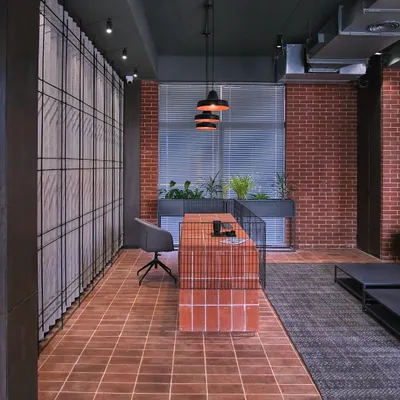 The reception for the student housing at Jaipuria Institute of Management, Noida. The design uses raw, honest materials like exposed brick and terracotta tiles to create a warm, grounded, and inspiring atmosphere for students.