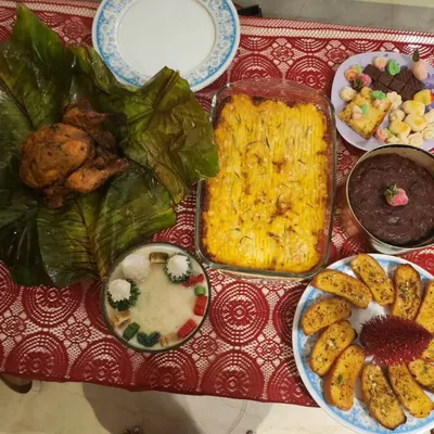 A beautiful Christmas catering spread featuring my Kerala spiced whole chicken, shepherd's pie, and rum cake. I love bringing festive cheer to your celebrations with a hearty, home-cooked meal.