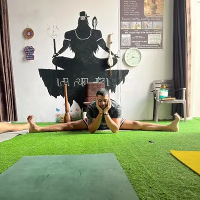 Working on the middle splits, or Samakonasana. This is a deep hip opener that takes time and patience. The goal is progress, not perfection.