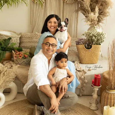 Because every family portrait is better with a furry friend! This family of three becomes a family of four with their adorable French bulldog joining the studio session.