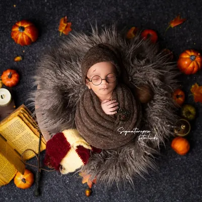 Our tiniest wizard has arrived! This Harry Potter themed newborn shoot is one of our most requested, complete with a Gryffindor scarf, wand, and spell books for a truly magical first portrait.