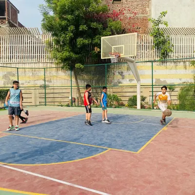 Our junior players learning the fundamentals of dribbling and court awareness.