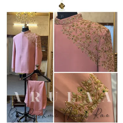 This blush pink Jodhpuri suit is a perfect example of modern royalty. The asymmetrical cut is paired with stunning gold zardosi embroidery that flows from the shoulder down the sleeve and cuff, creating a truly unique piece for a groom.