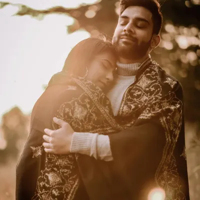 A warm, intimate hug during golden hour in Shimla. The soft sunset light and the authentic emotion in this pre-wedding photo make it a perfect memory of a mountain getaway.
