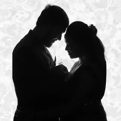This artistic silhouette of parents holding their newborn is the ultimate family portrait. It symbolizes the beginning of a new journey and is a powerful, emotional piece of art for your home.