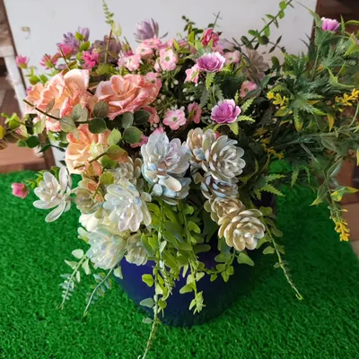 This is a custom arrangement of high-quality artificial flowers and foliage in a classic blue ceramic pot. My artificial bushes are UV-treated and washable, ensuring they stay vibrant and beautiful with zero maintenance.