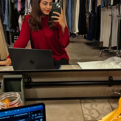 This is my happy place, surrounded by clothes and ideas. Here I am at my desk, working on a mood board and concept for an upcoming shoot, with racks of wardrobe options ready to go.