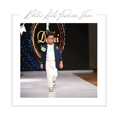 This young model brings a cool, modern edge to the runway in a white tee, white pants, and a stylish blue jacket. The sunglasses add the perfect touch of star quality to this portfolio shot.