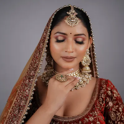An outstanding bridal look created by a student for their final exam. The soft, blended eyeshadow and flawless skin are a testament to the skills they learned.