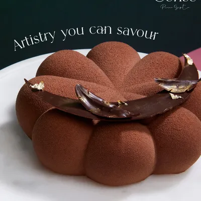 This is artistry you can savour. My Chocolate Dreams entremet, with its velvety texture and intricate chocolate garnish, is a masterpiece in every bite.