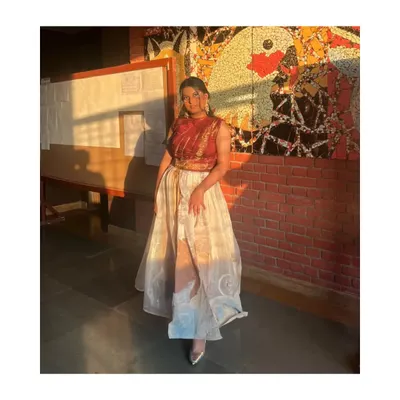 This was for a college fashion show. I styled this Indo-western look which features a draped brocade top and a layered organza skirt. It’s a great example of how to mix traditional fabrics with modern cuts.