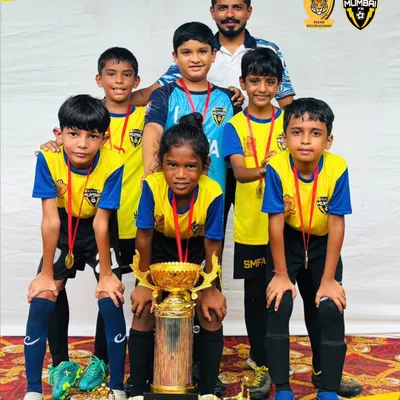 Our SMFA U10 warriors with their championship trophy. This victory is a result of teamwork, discipline, and the skills they build session after session.