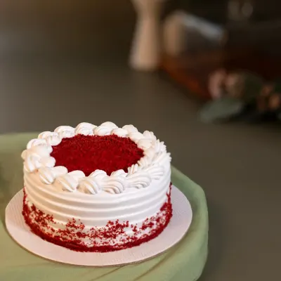 Our Red Velvet Bento Cake is a miniature version of the classic, with moist red velvet sponge and creamy frosting, perfect for a personal celebration.