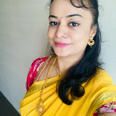 A close-up of my self-makeover, featuring a simple and elegant look that complements this beautiful yellow Mysore silk saree. This is a great example of a classic, traditional look.
