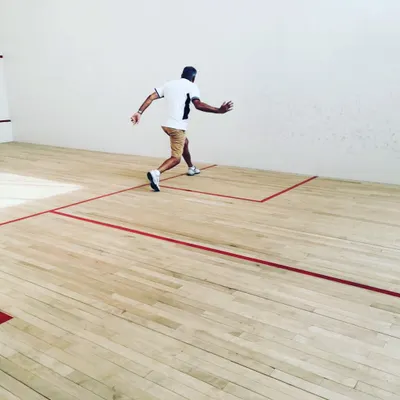 Coach Ray Malik demonstrates how to cover the court efficiently. Learning from an experienced professional helps our players understand positioning and anticipation.