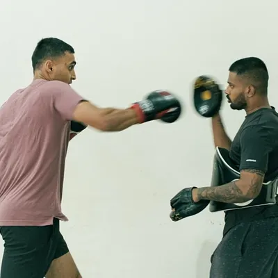 A glimpse into the sharp, focused pad work during a personal training session. Here, we're drilling a classic boxing combination, focusing on speed and accuracy.