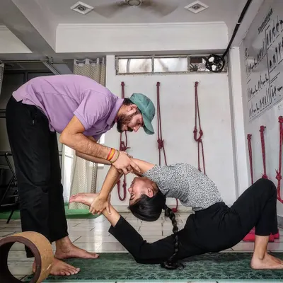 Hands-on adjustment is key to our Iyengar-based teaching. Here, Nishant Sir assists a student in a deep backbend, ensuring safety while helping her achieve greater flexibility in the spine.