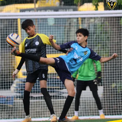 Real players rise under pressure. This action shot from a youth match shows the intensity and tactical awareness we instill in our players.