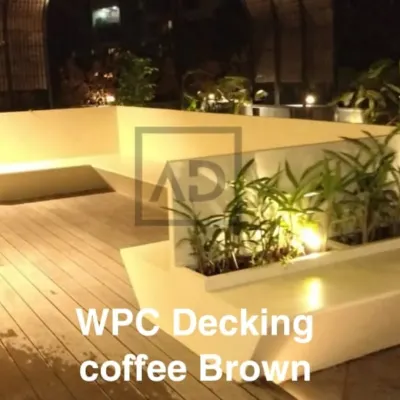 This L-shaped seating area is built directly into the terrace design, seamlessly integrated with the coffee brown WPC decking. The planters are also part of the structure, creating a clean, unified look.