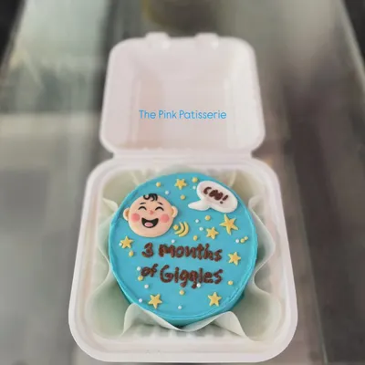A cute bento cake celebrating "3 Months of Giggles." These mini cakes are perfect for marking smaller milestones.