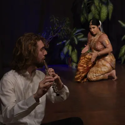 A moment from my collaboration with a Western flautist, where we explored Debussy's 'Afternoon of a Faun'. I drew inspiration from the legendary dancer Vaslav Nijinsky's revolutionary ballet to create a fusion of Bharatanatyam and Western modern dance concepts.