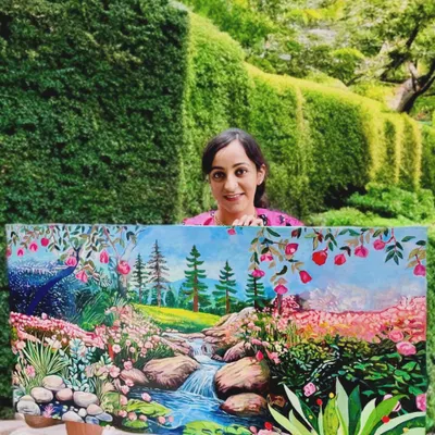 This is a large 5ft by 3ft acrylic painting of a vibrant, joyful landscape. Every flower, stream, and stone is painted to whisper a message of peace and harmony, serving as a beautiful reminder of the tranquility that nature holds.