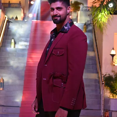 I had the pleasure of dressing the dashing host of MTV Splitsvilla, Tanuj Virmani. He is seen here in a unique maroon belted designer suit from my collection, perfect for making a statement on the red carpet.