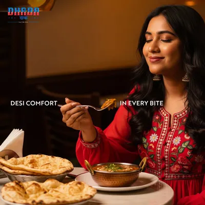 A woman savouring a spoonful of curry at Dhaba, with a smile of pure satisfaction. This image perfectly encapsulates the feeling of 'desi comfort in every bite' that my Indian restaurants provide.
