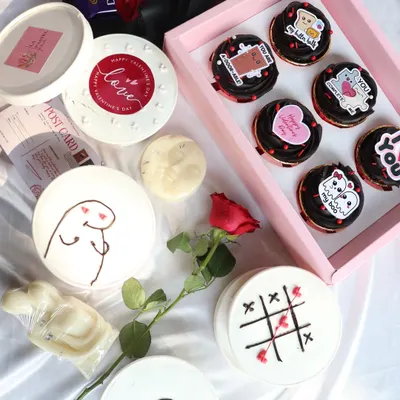 This is my Valentine's collection spread. It shows the variety you can get, from the 'Love Notes' cupcake box to the individual tub cakes with cute meme designs.