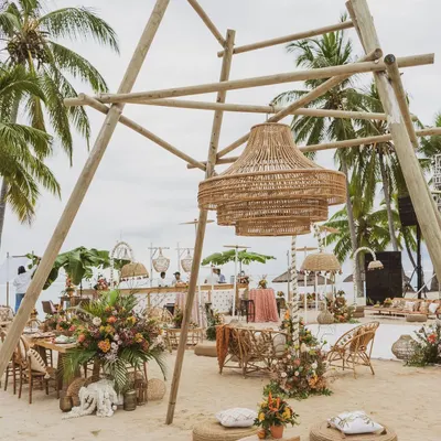 We designed this 'Rustic Tropics' celebration on the sands of Mauritius, using a massive bamboo structure and wicker lantern as the central design element.