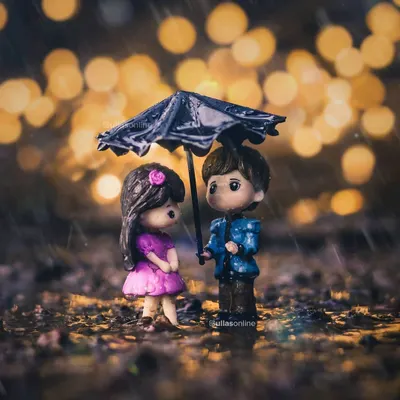A charming miniature scene of a couple under an umbrella in the rain, with beautiful bokeh lights in the background creating a romantic mood.