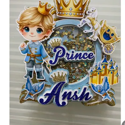 A royal celebration calls for a royal topper. This Prince shaker topper is handcrafted with layers of blue and gold glitter cardstock, featuring a castle, carriage, and a shaker element for extra sparkle.